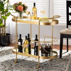 Kamal Glam Brushed Metal And Mirrored Glass 2 Tier Mobile Wine Bar Cart Gold - Baxton Studio 21 Kamal Glam Brushed Metal And Mirrored Glass 2 Tier Mobile Wine Bar Cart Gold - Baxton Studio -Restaurant Furniture Store GUEST 034e04a5 db63 474b 9d05 6c159816da1c